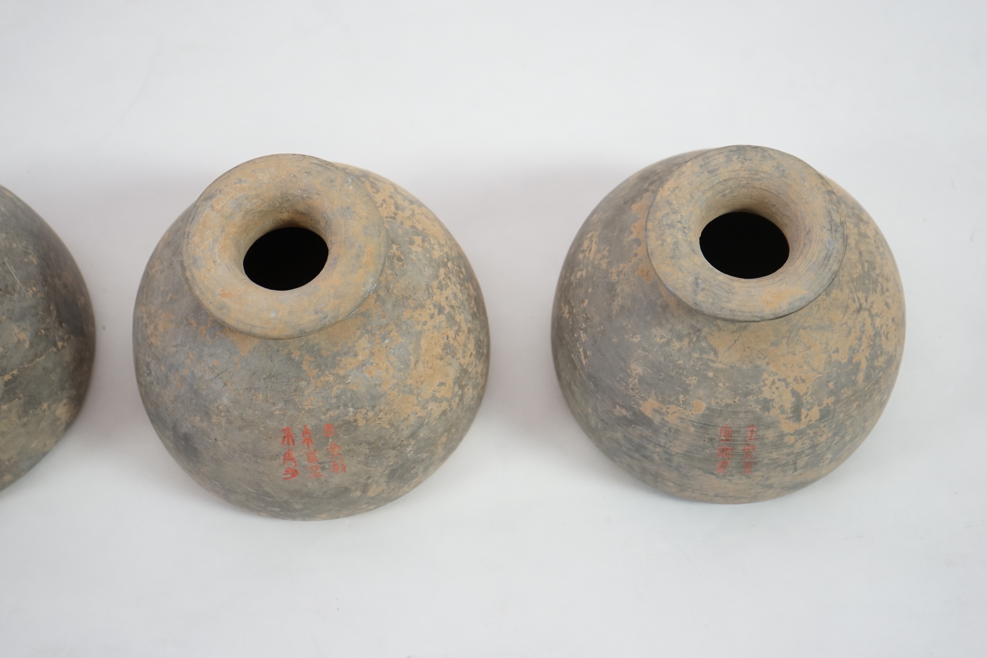 Four very rare Chinese inscribed pottery jars, Han dynasty